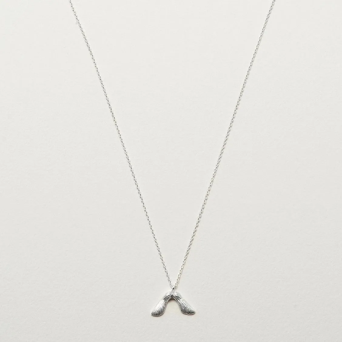 Necklace with maple seed pendant in silver