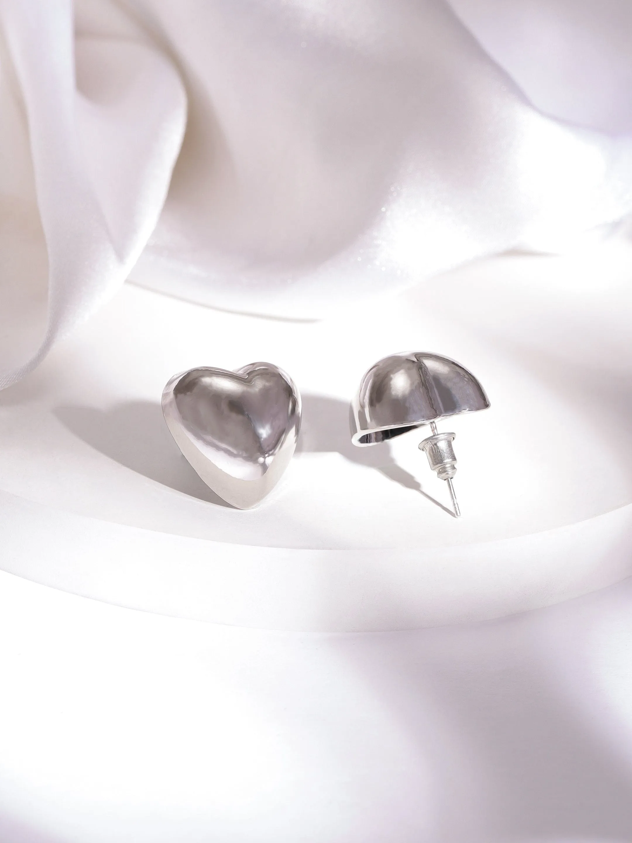 Rubans Rhodium Plated Heart Shaped Stud Earrings with Sleek Silver Tone Finish