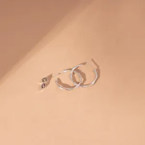 Sleek Silver Twirl Hoop Earrings | SKU: 0003085691, 0019311920, 0019311937